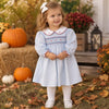 BLUE DOT PRINT DRESS WITH CORDED SMOCKING