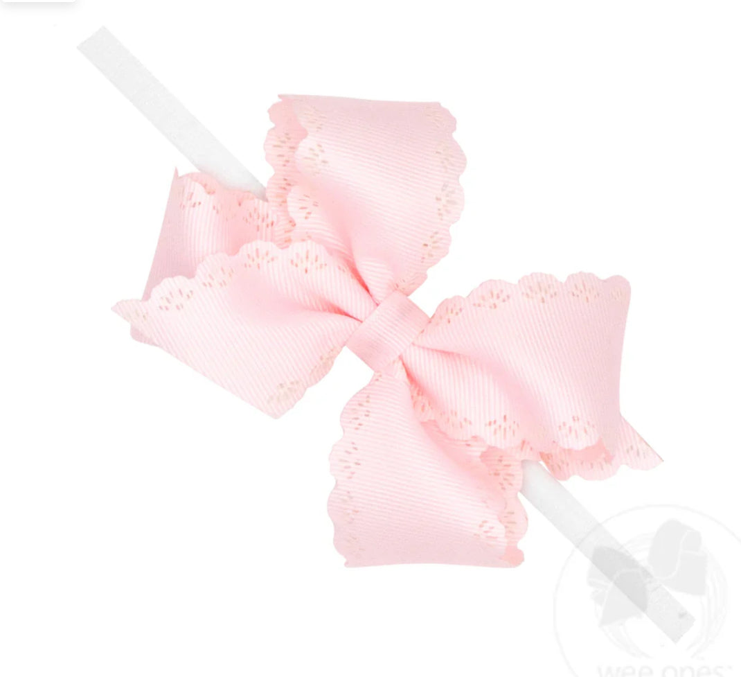 Small Powder Pink Grosgrain Hair Bow w/
Embossed Eyelet Edge on White Nylon
Band