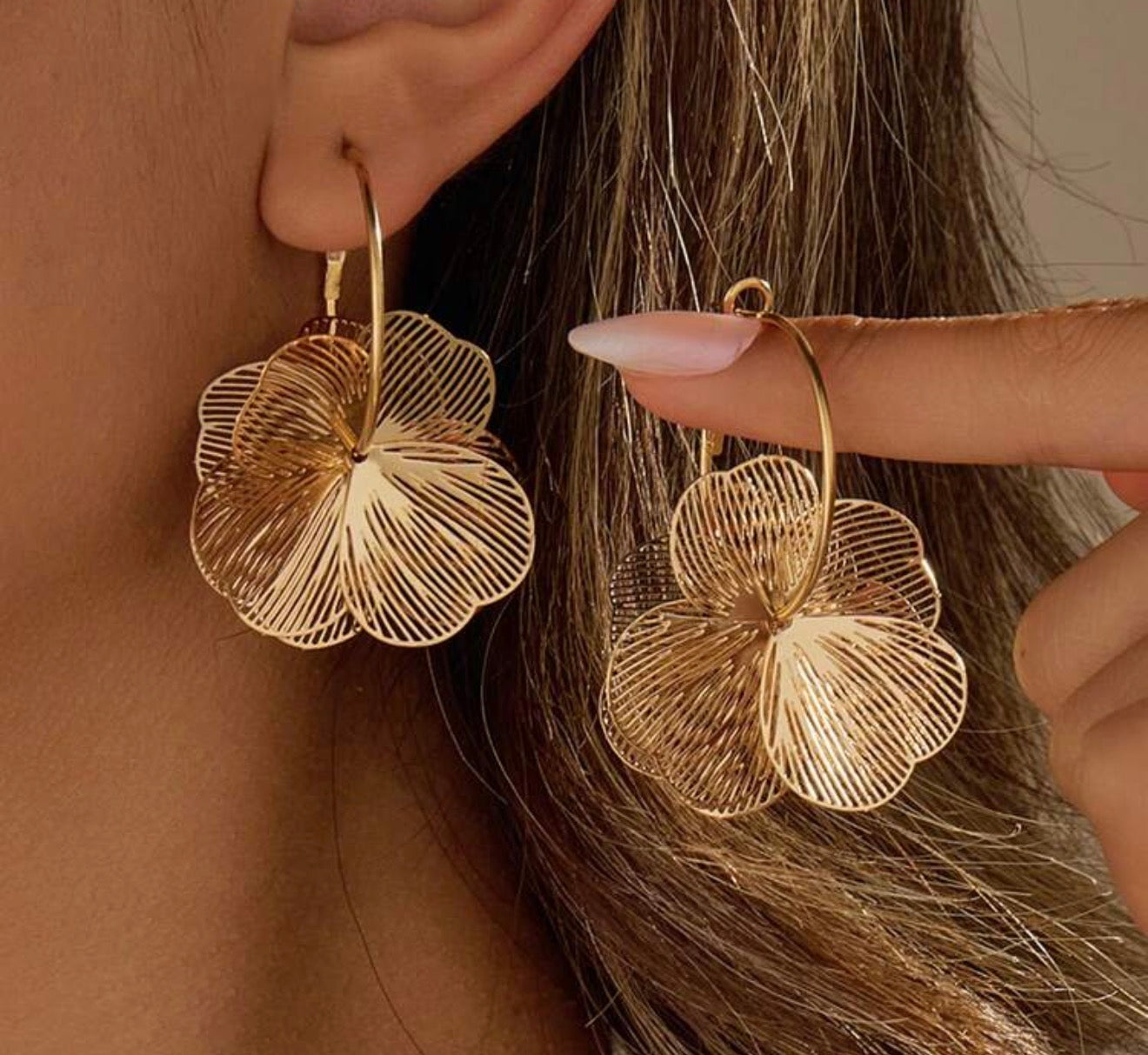 Gold tone flower drop earrings